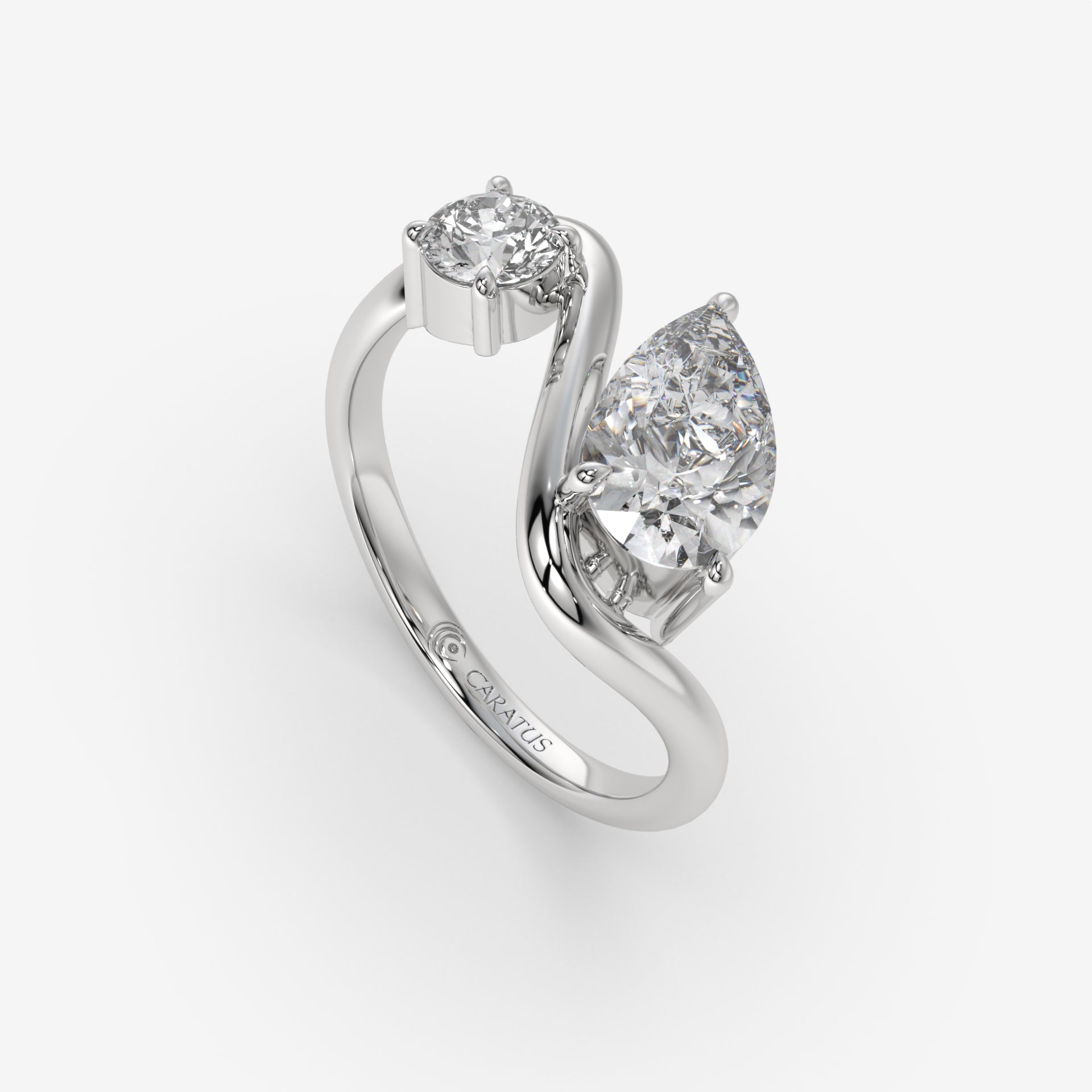Intertwined Pear-Shaped Diamond White Gold Ring with Round Diamond