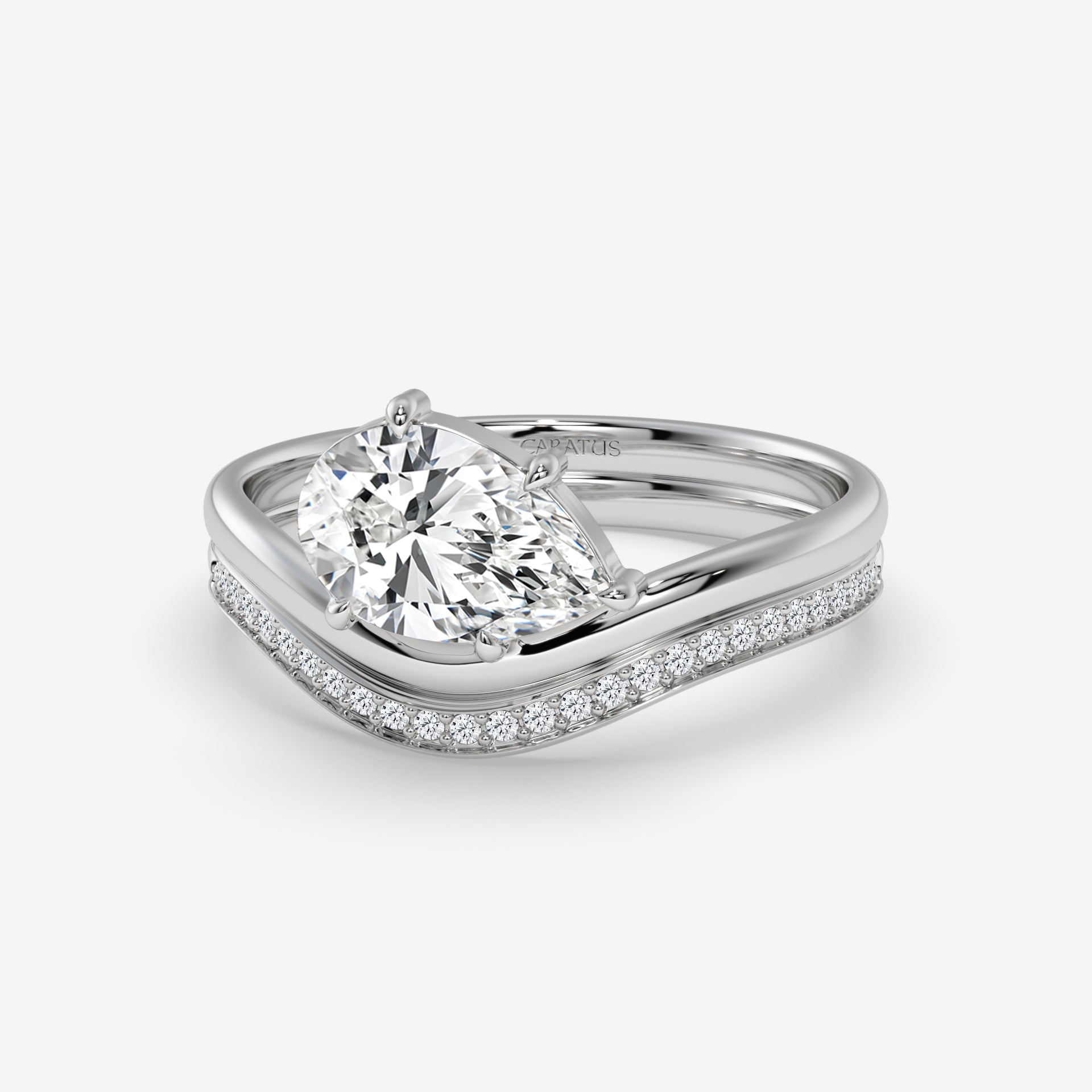 Pear-Shaped Diamond Ring with Round Diamonds in Yellow Gold