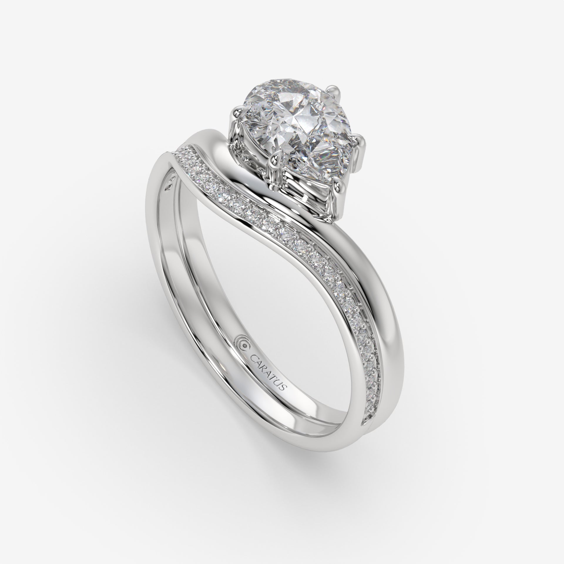 Pear-Shaped Diamond Ring with Round Diamonds in White Gold