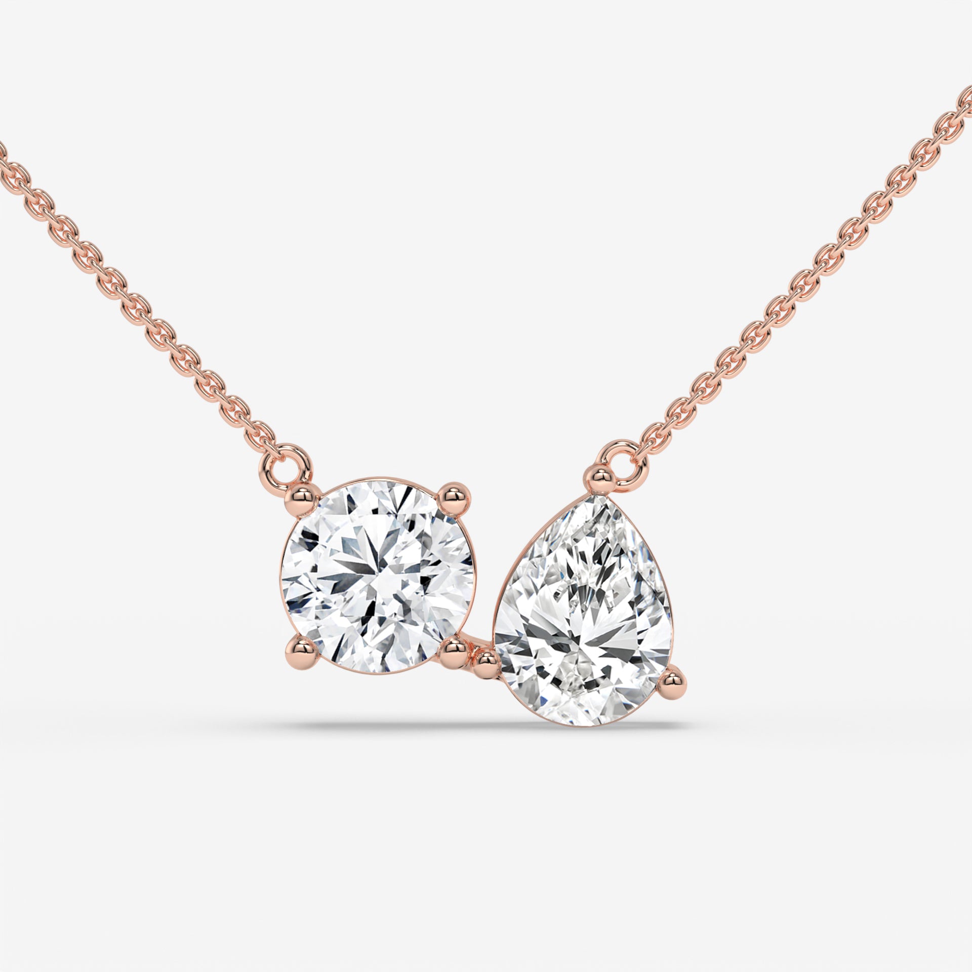 Pear and Round Duet Pendant in Yellow Gold