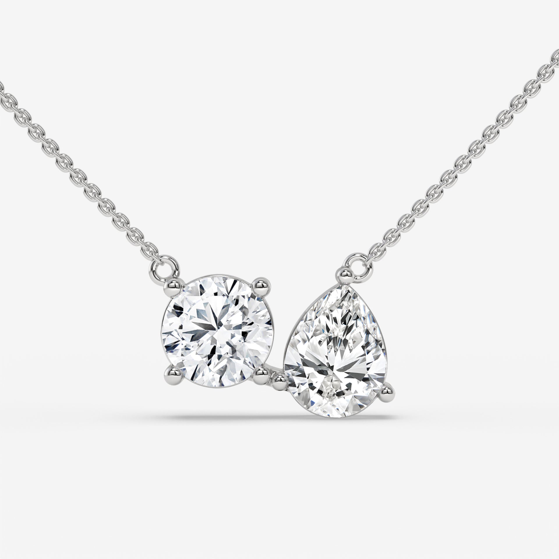 Pear and Round Duet Pendant in Yellow Gold