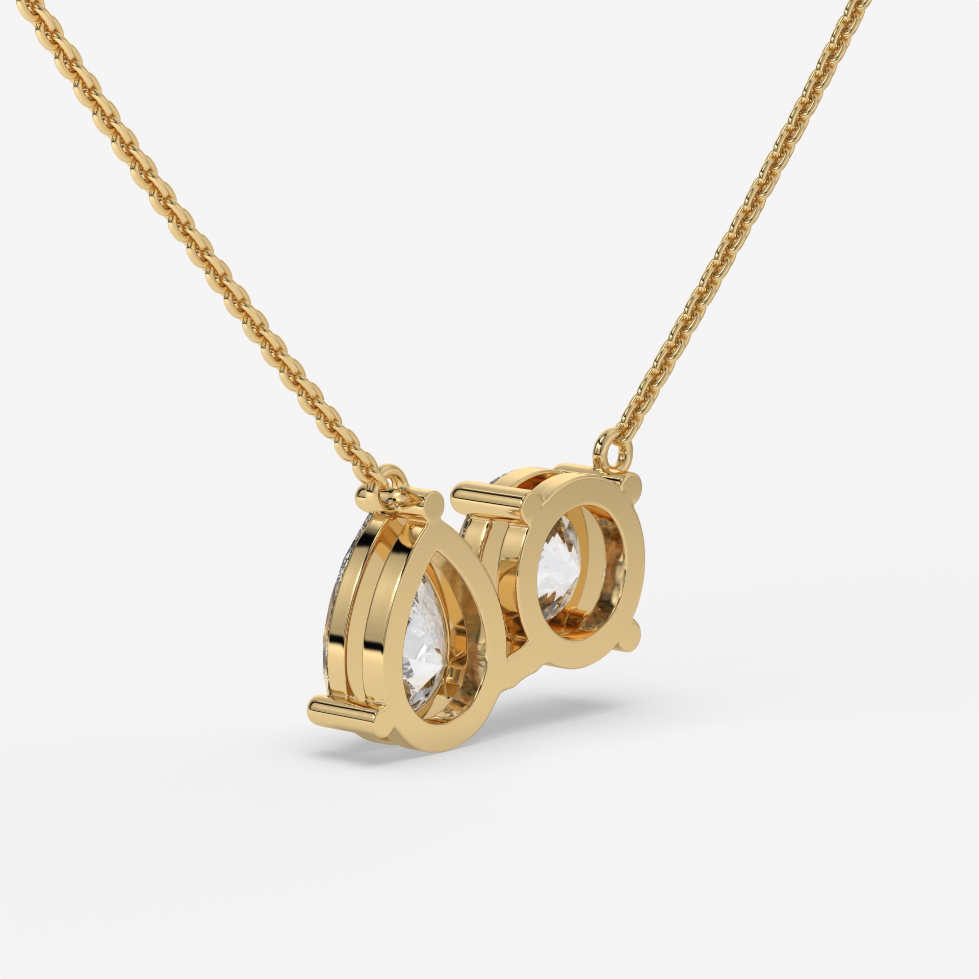 Pear and Round Duet Pendant in Yellow Gold