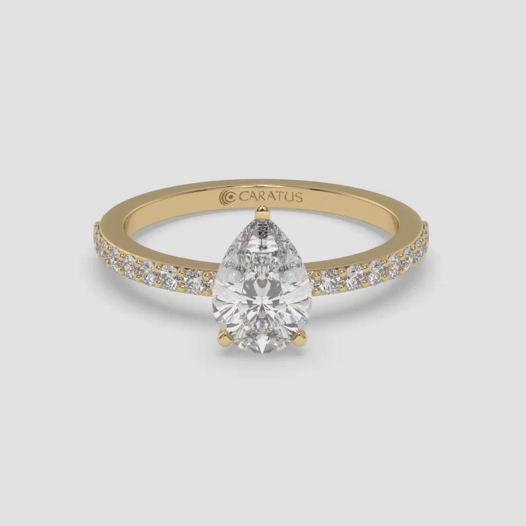 Pear-Shaped Diamond Yellow Gold Ring with Channel Set Band