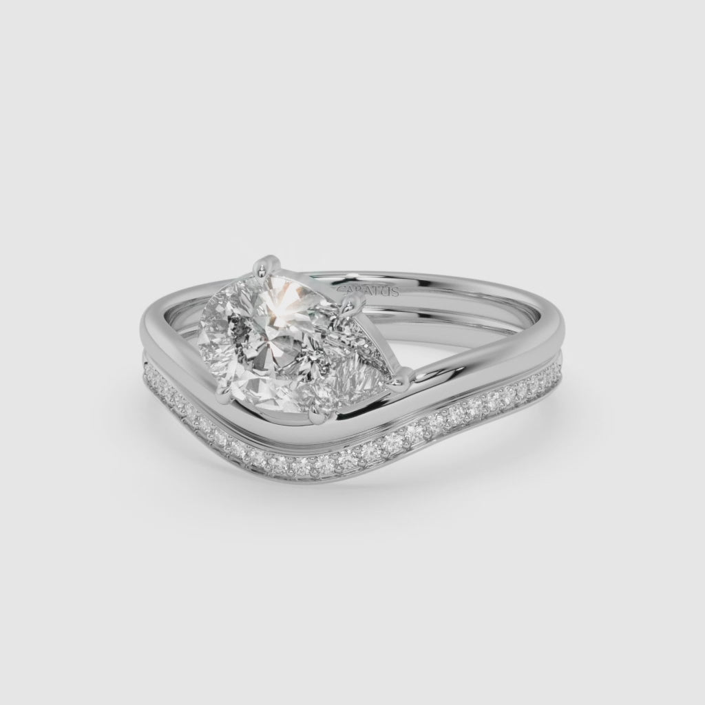 Pear-Shaped Diamond Ring with Round Diamonds in White Gold