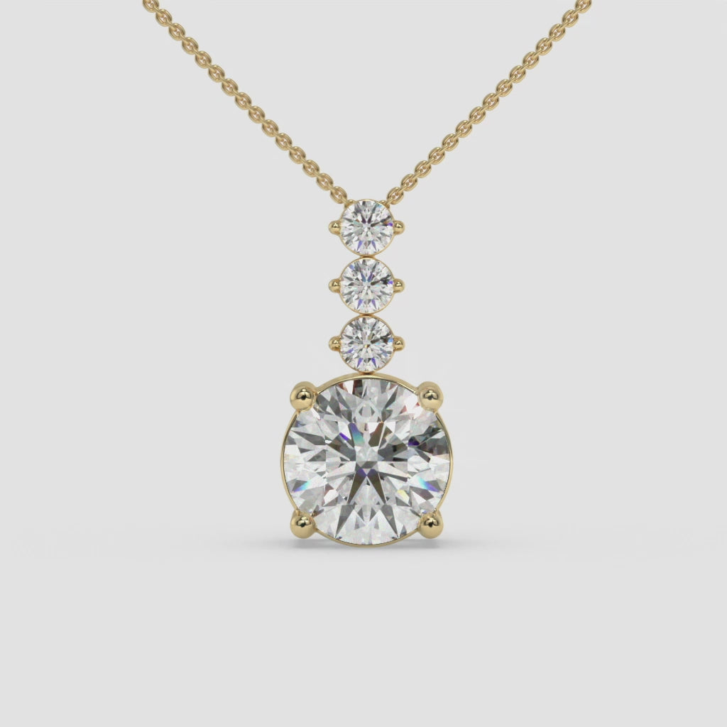 Radiant Three-Stone Round-Cut Yellow Gold Diamond Pendant