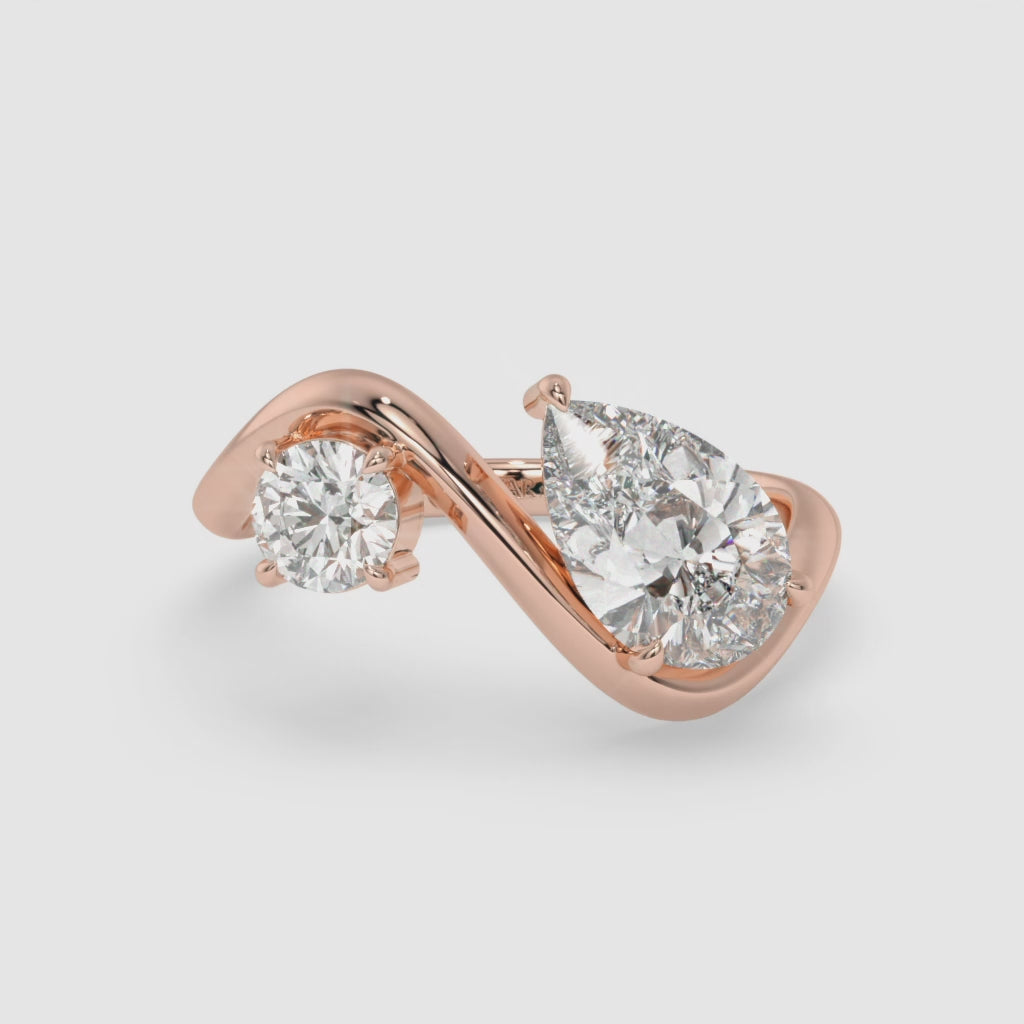 Intertwined Pear-Shaped Diamond Rose Gold Ring with Round Diamond