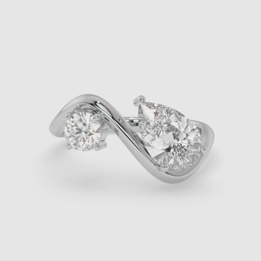 Intertwined Pear-Shaped Diamond White Gold Ring with Round Diamond