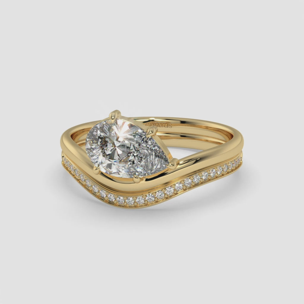 Pear-Shaped Diamond Ring with Round Diamonds in Yellow Gold