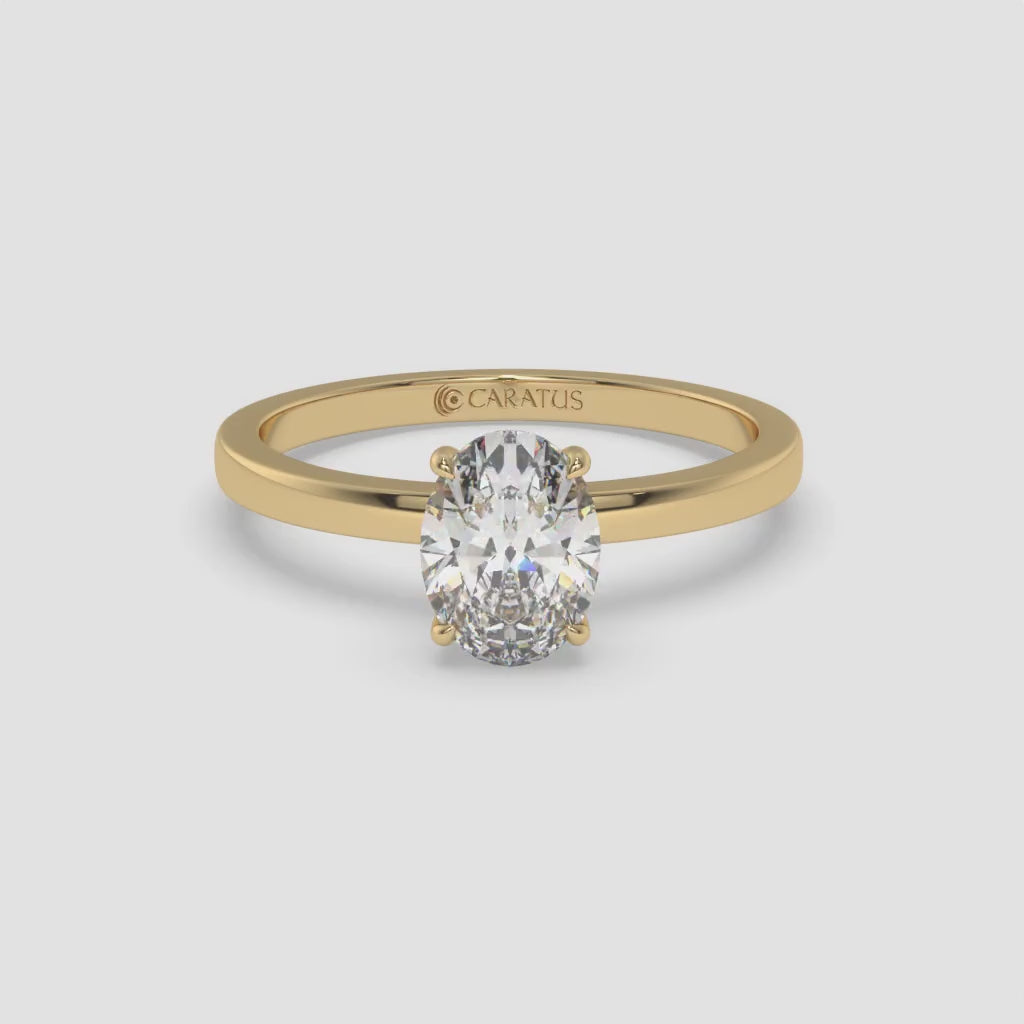 Yellow Gold Oval Diamond Ring with Round Side Stones