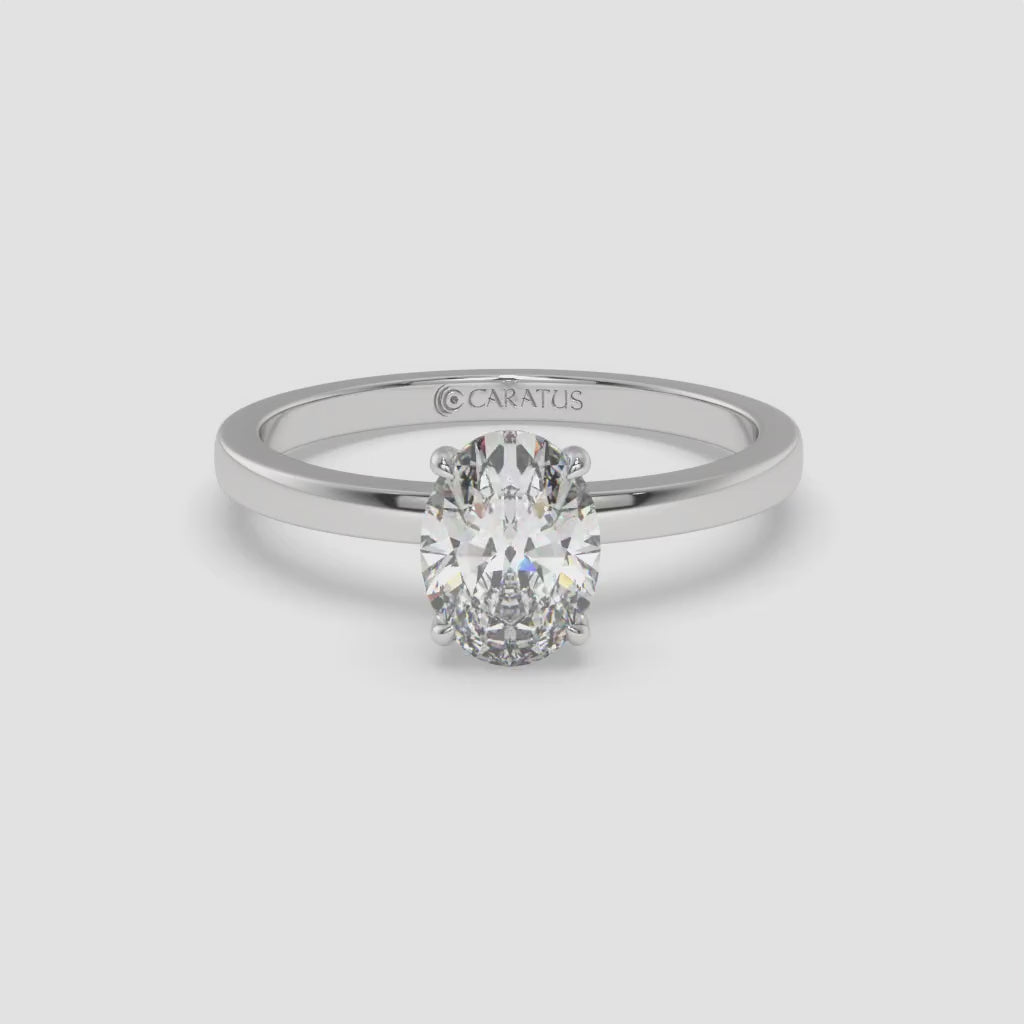 White Gold Oval Diamond Ring with Round Side Stones