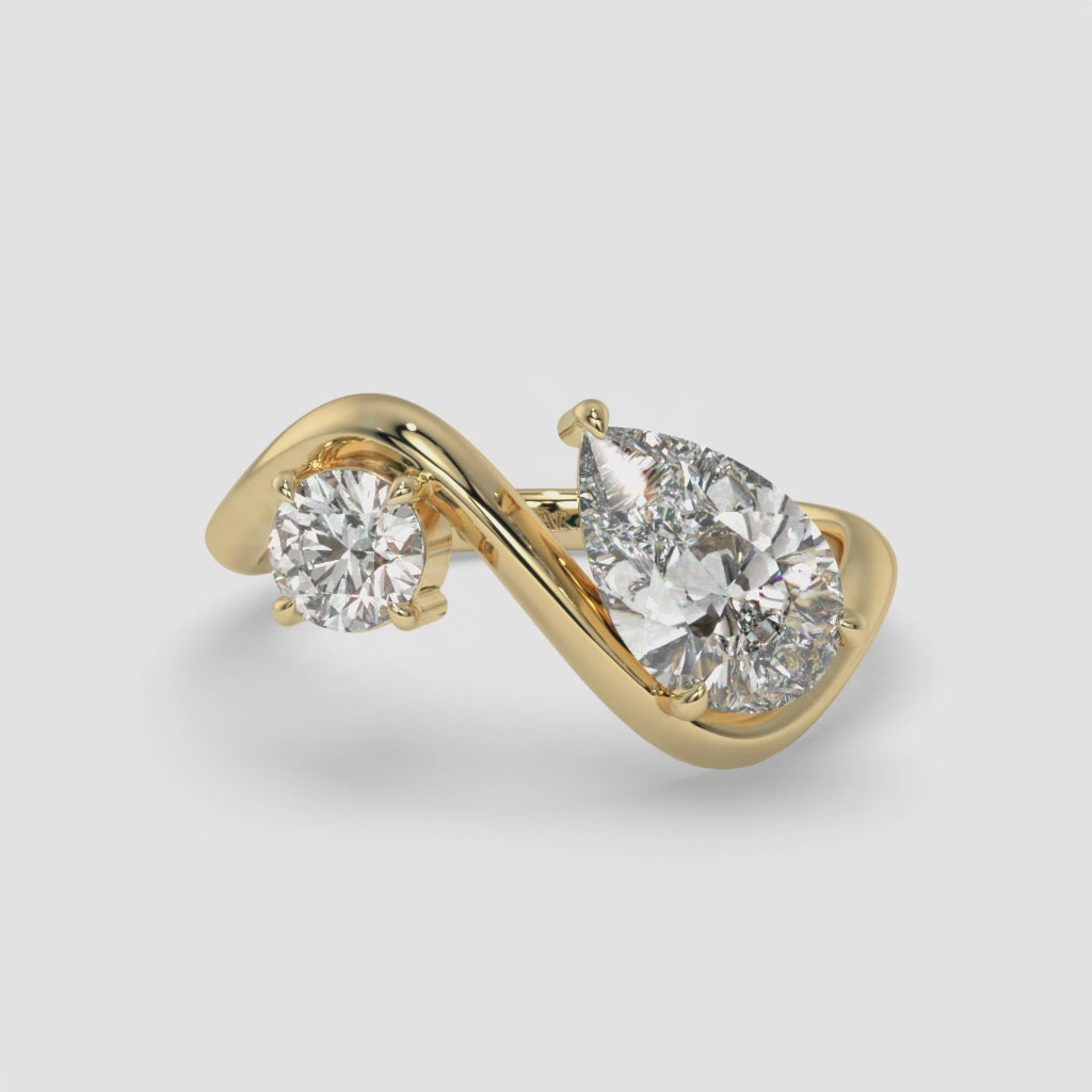 Intertwined Pear-Shaped Diamond Yellow Gold Ring with Round Diamond